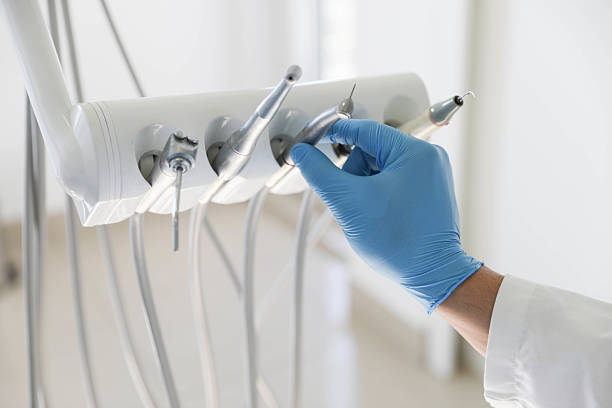 Professional Tooth Extraction technician working in Waltham, MA